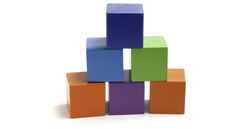 Six square children's blocks form a pyramid.